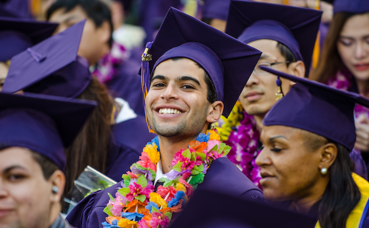 Graduate smiling to the camera