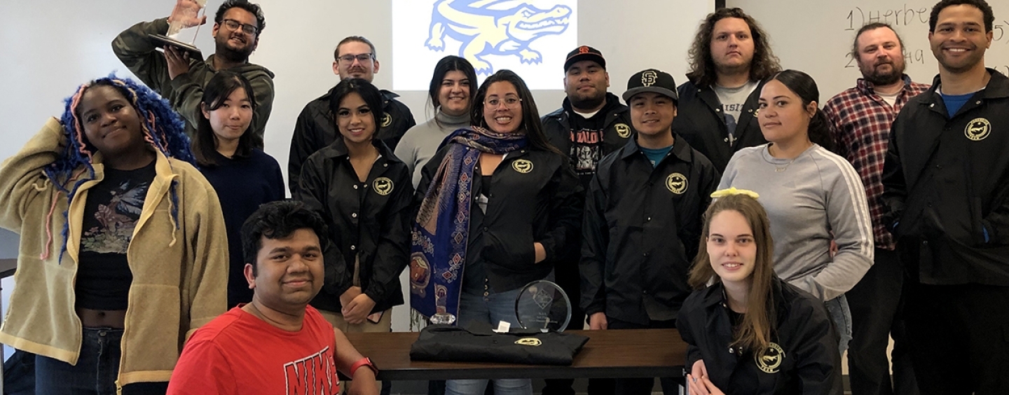 Forensics Team at SF State posing together in a classroom