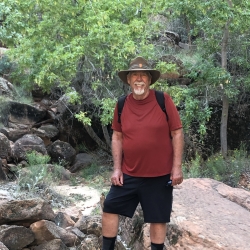Photo of Lawrence Medcalf posing in a forest